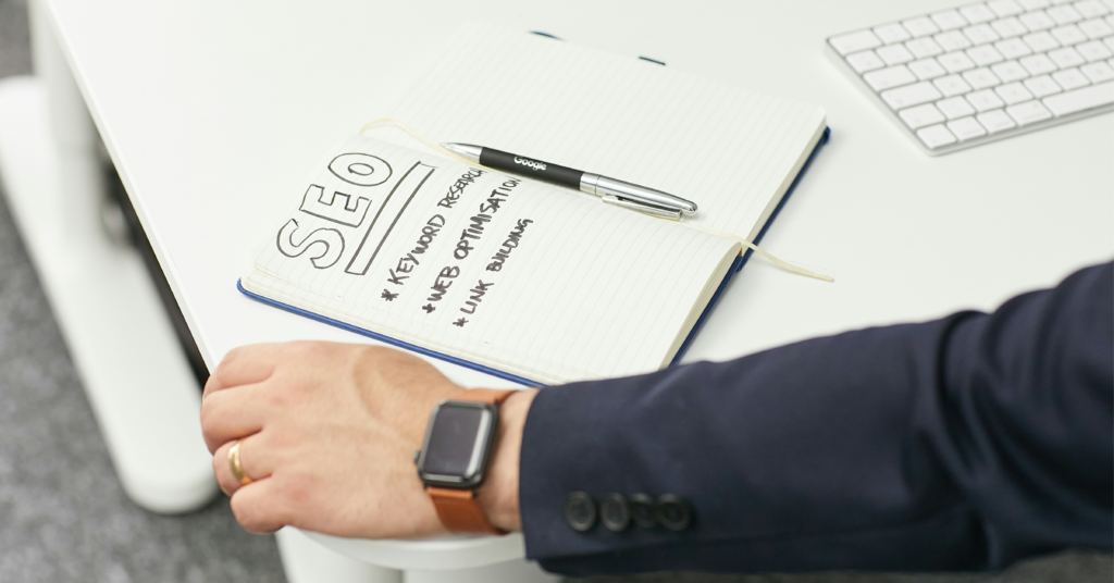 SEO planning notebook showing keyword research, web optimization and link building